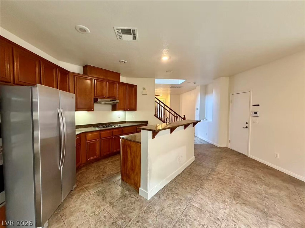11183 Ranch Valley Street Las Vegas, NV 89179 - Photo 4 of 19 Prepare meals in a kitchen featuring sleek stainless steel appliances and abundant cabinetry.