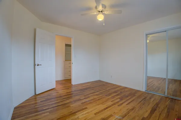 a view of an empty room with empty shelves