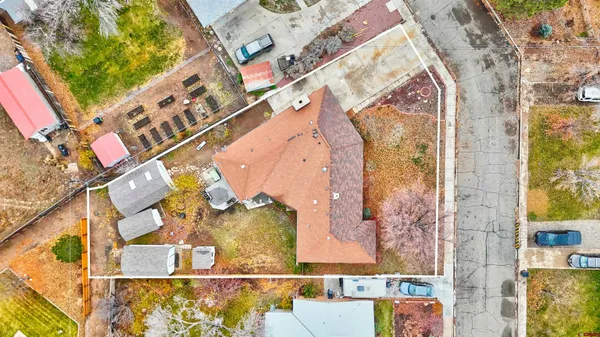 an aerial view of residential building and car parked