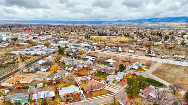 an aerial view of residential houses with outdoor space
