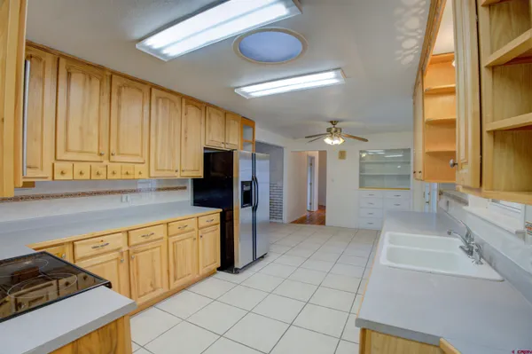a kitchen with stainless steel appliances a refrigerator and a sink