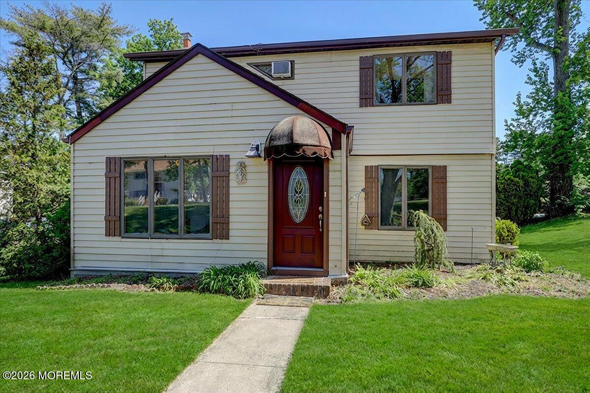 659 Holmdel Road Hazlet, NJ 07730 - Photo 2 of 41 a front view of a house with garden