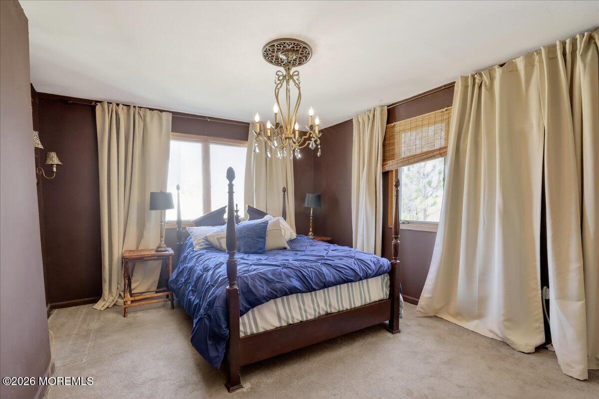 659 Holmdel Road Hazlet, NJ 07730 - Photo 23 of 41 a bedroom with a bed and a window
