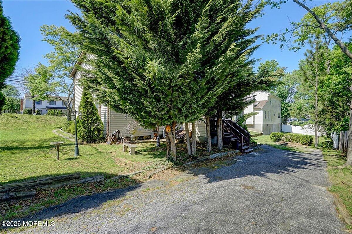 659 Holmdel Road Hazlet, NJ 07730 - Photo 33 of 41 a view of a tree in front of a house
