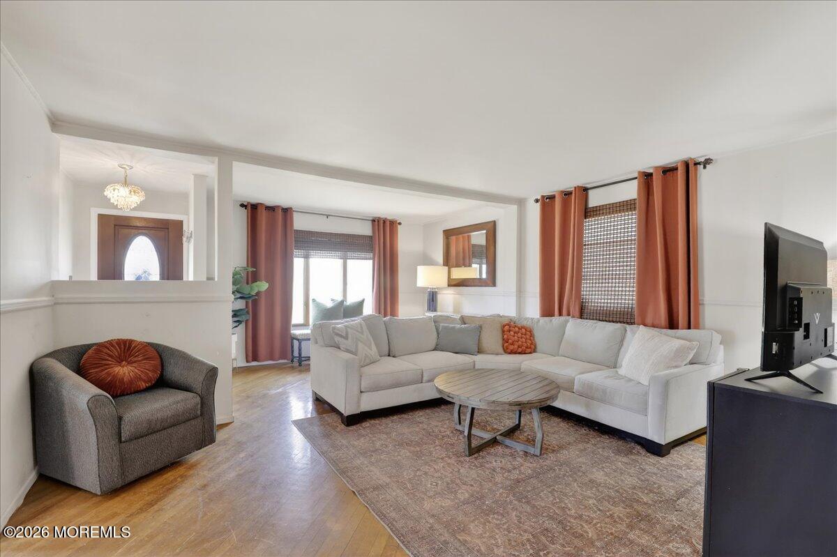 659 Holmdel Road Hazlet, NJ 07730 - Photo 9 of 41 a living room with furniture and a flat screen tv