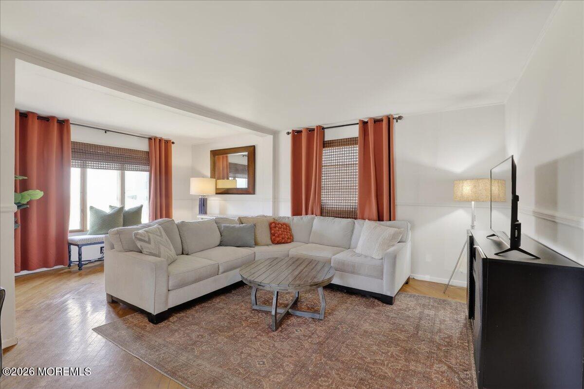 659 Holmdel Road Hazlet, NJ 07730 - Photo 10 of 41 a living room with furniture and a flat screen tv