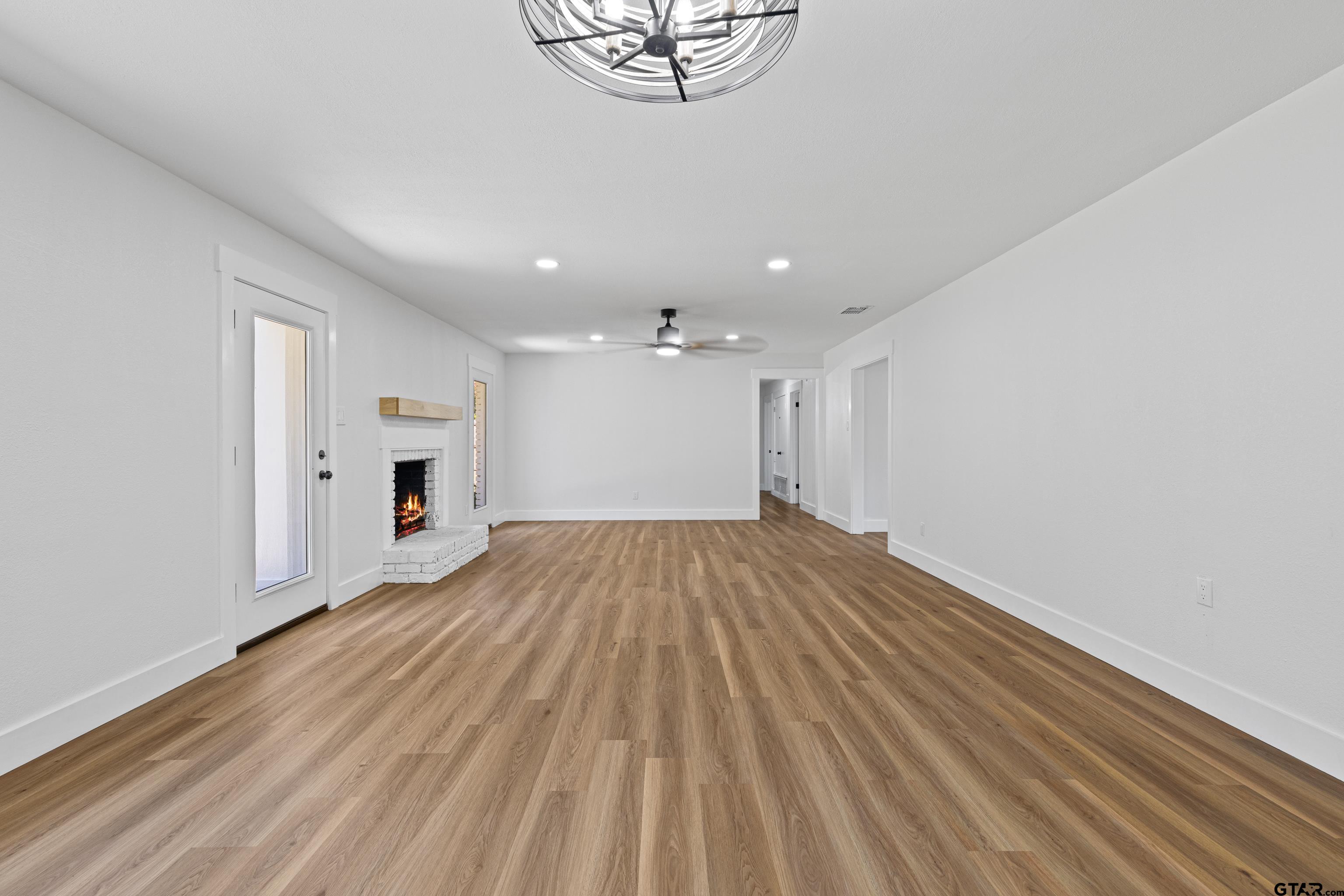 1907 Beth Drive Longview, TX 75605 - Photo 17 of 40 a view of empty room with wooden floor