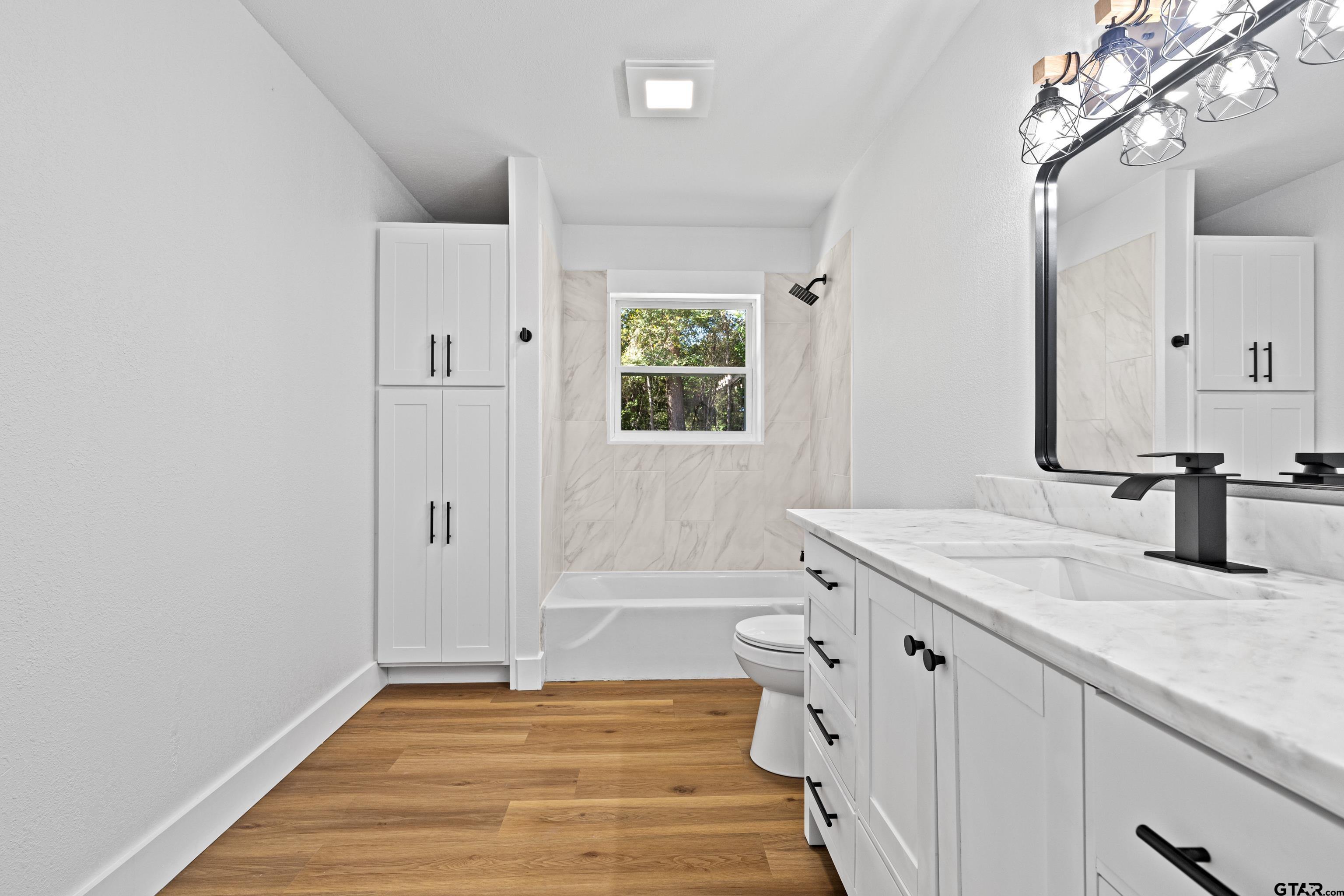 1907 Beth Drive Longview, TX 75605 - Photo 27 of 40 a bathroom with a sink and a mirror