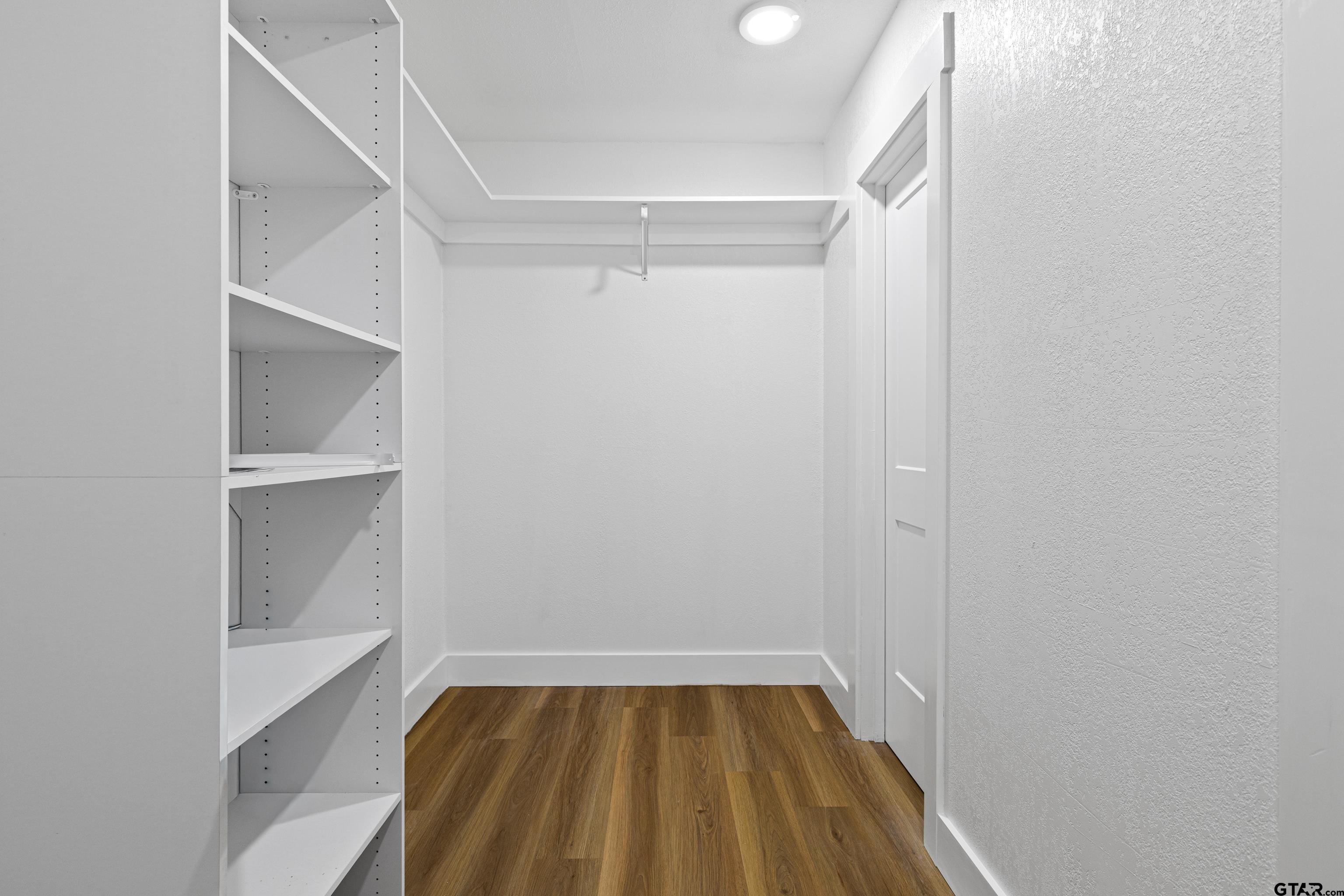 1907 Beth Drive Longview, TX 75605 - Photo 35 of 40 a view of walk in closet with empty racks