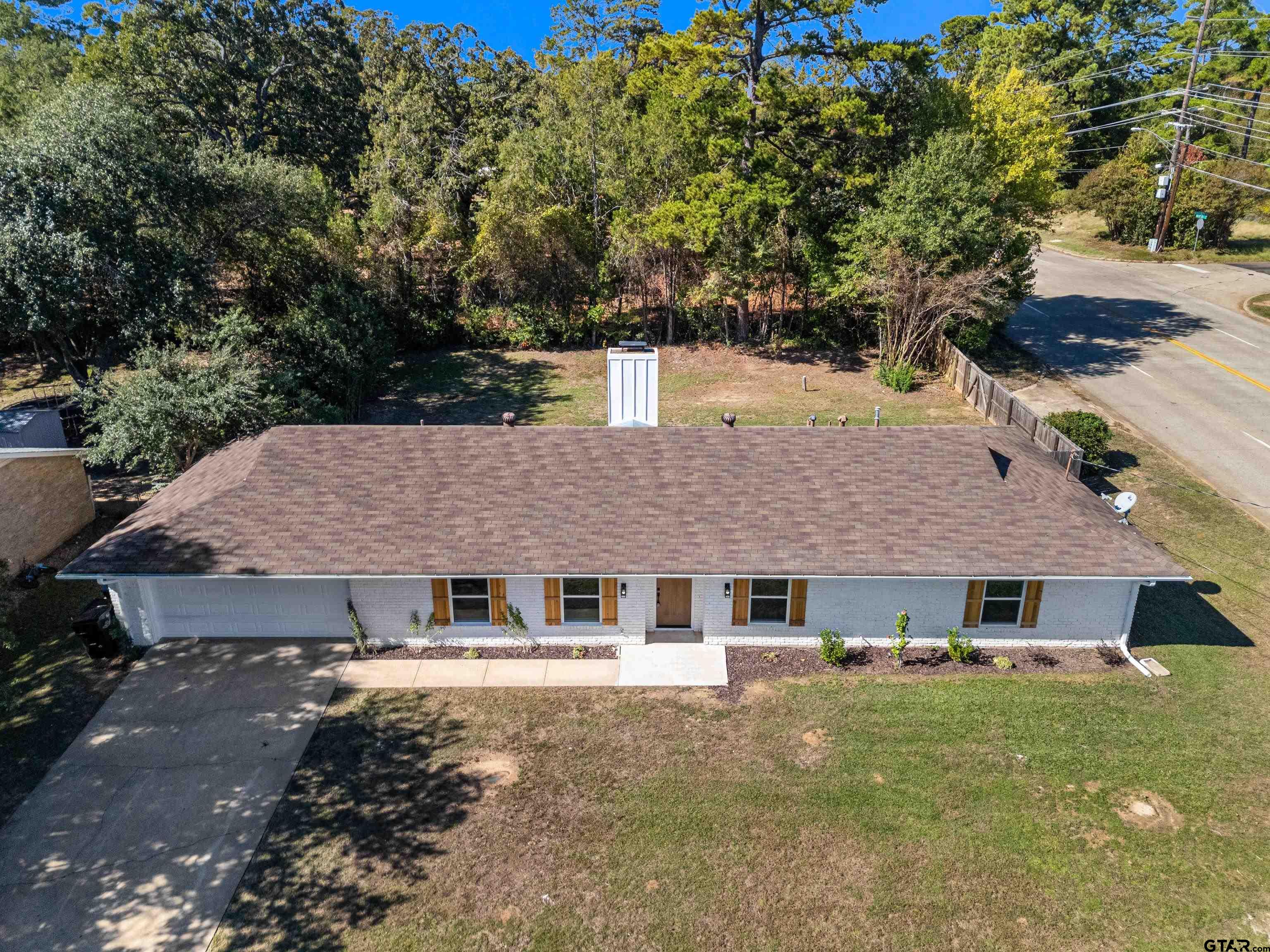 1907 Beth Drive Longview, TX 75605 - Photo 6 of 40 a aerial view of a house with a yard