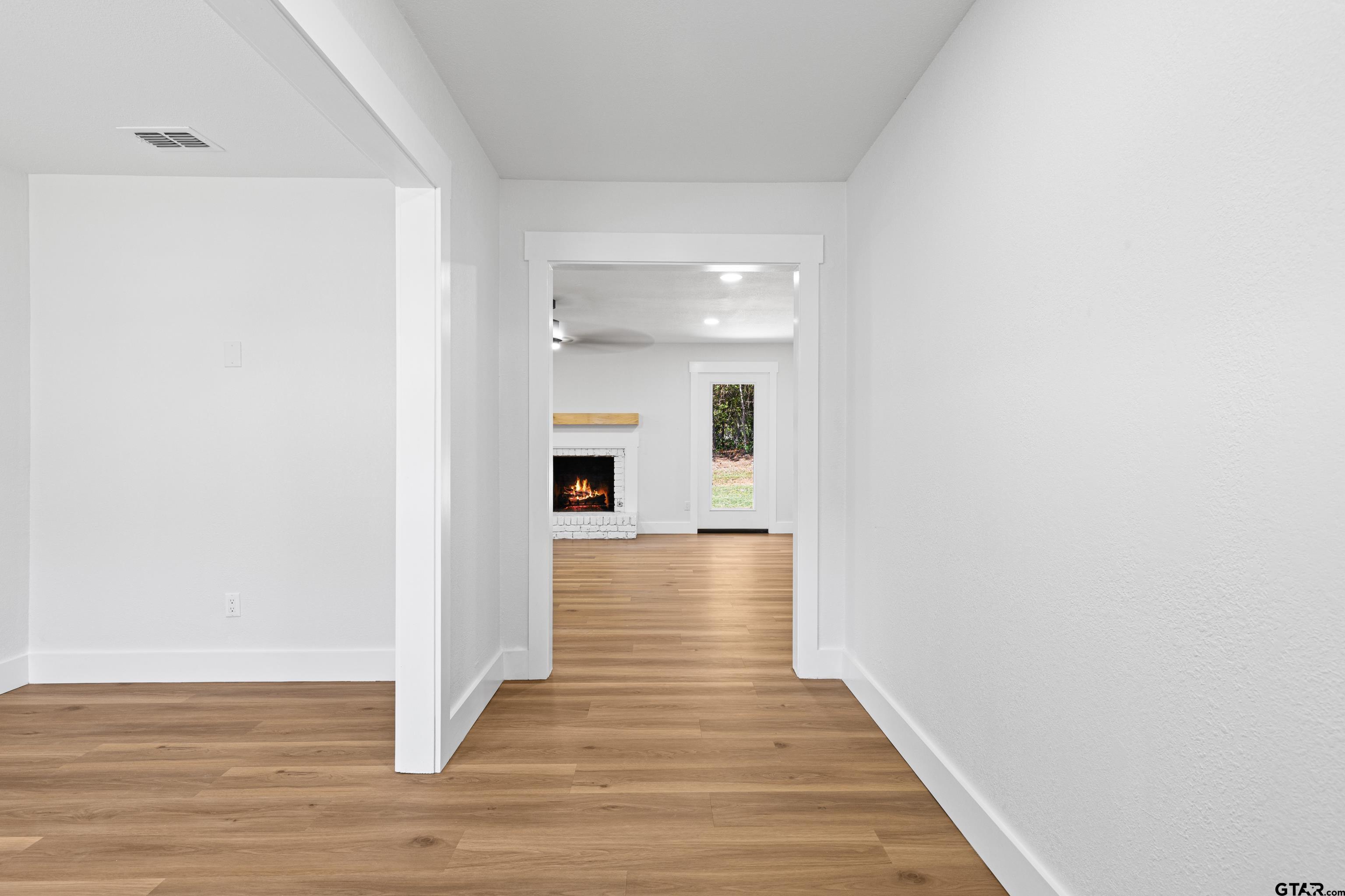 1907 Beth Drive Longview, TX 75605 - Photo 10 of 40 a view of a hallway with wooden floor