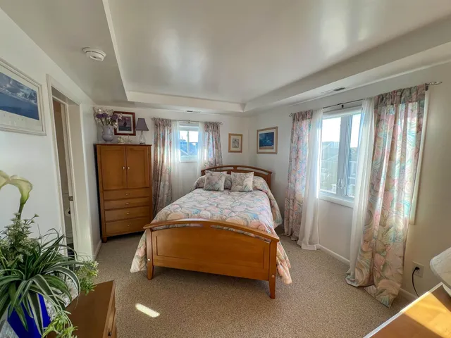 a bed room with a bed and a window