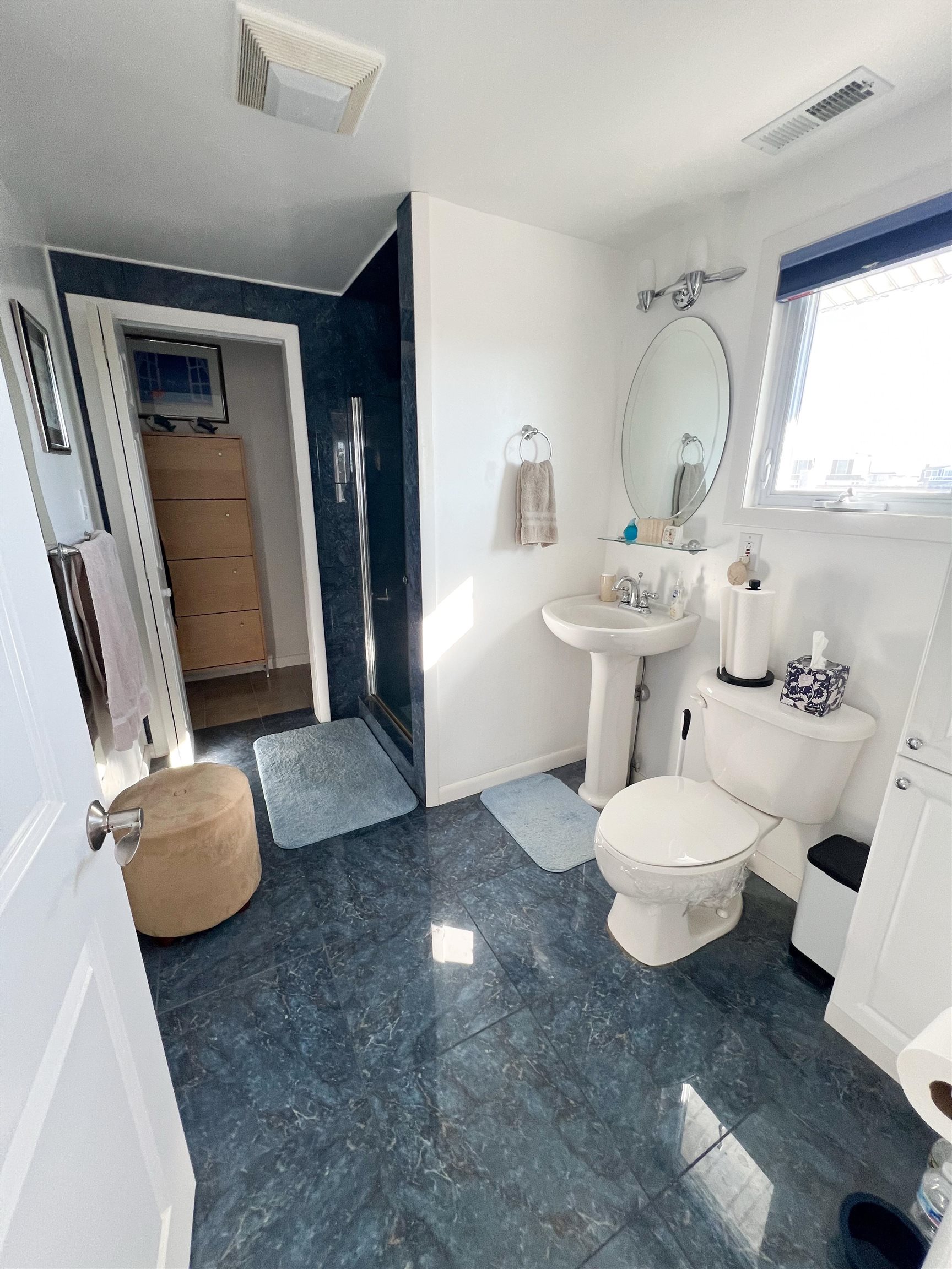 386 24th Street, Unit UPPR Avalon, NJ 08202 - Photo 16 of 34 a bathroom with a toilet sink a mirror and vanity