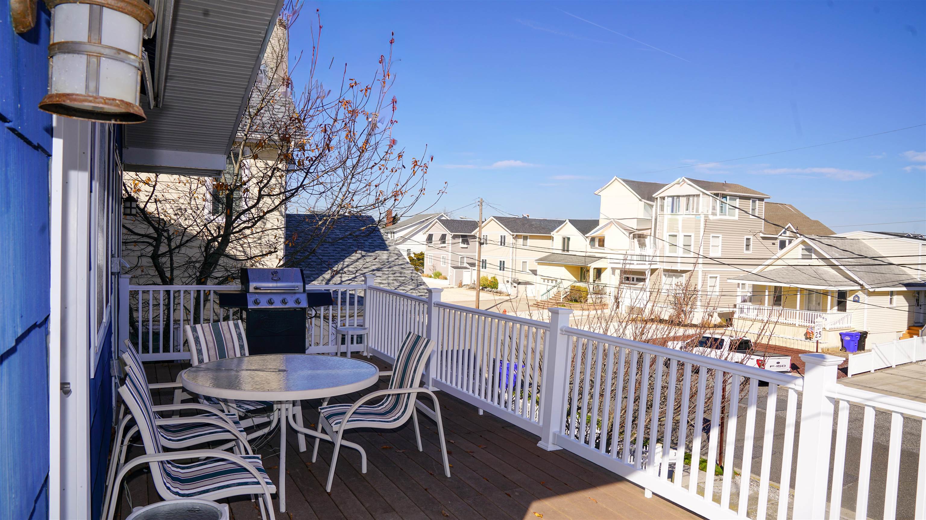 386 24th Street, Unit UPPR Avalon, NJ 08202 - Photo 26 of 34 a view of a table and chairs in patio