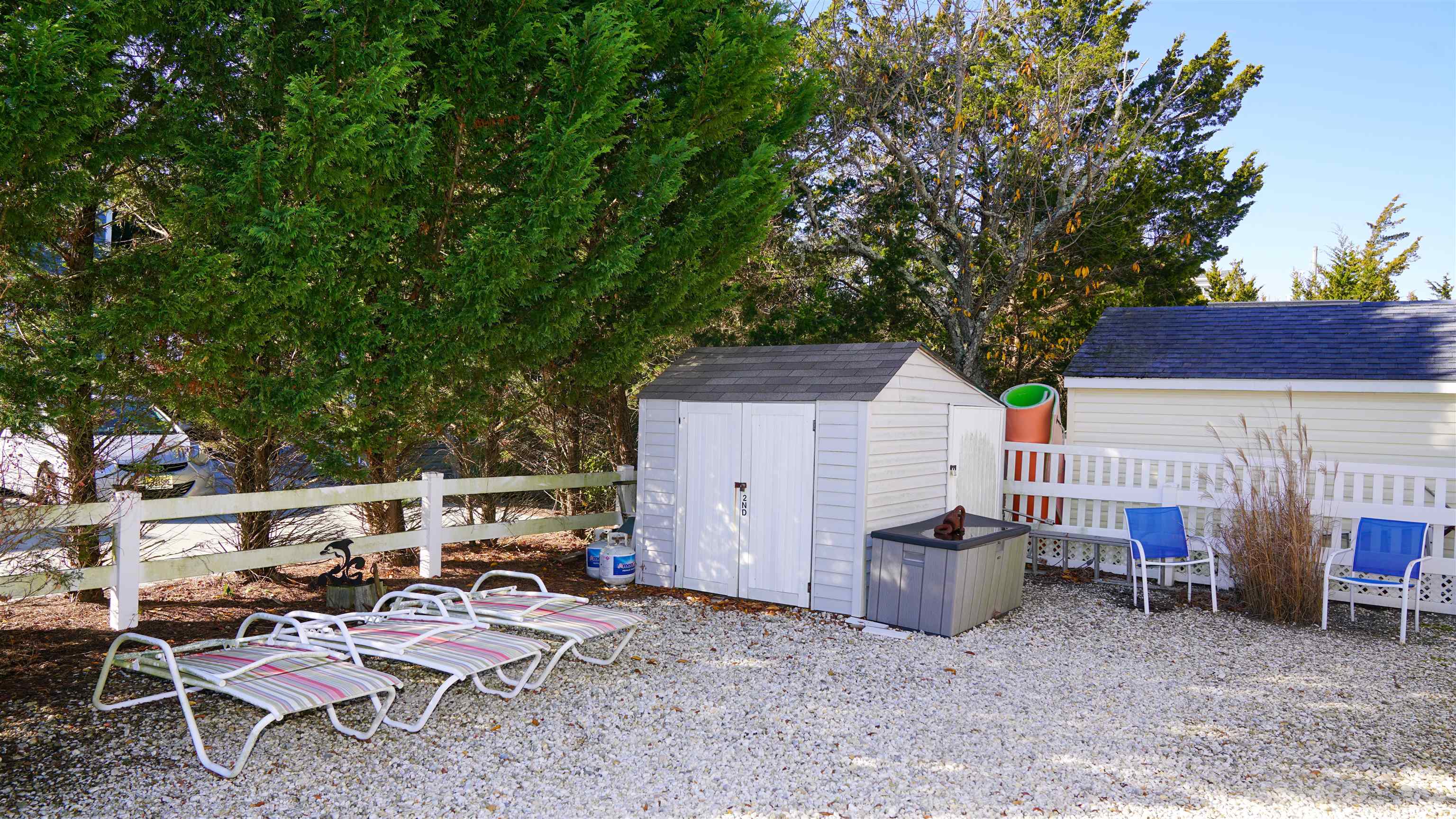 386 24th Street, Unit UPPR Avalon, NJ 08202 - Photo 29 of 34 a view of backyard with outdoor seating and trees
