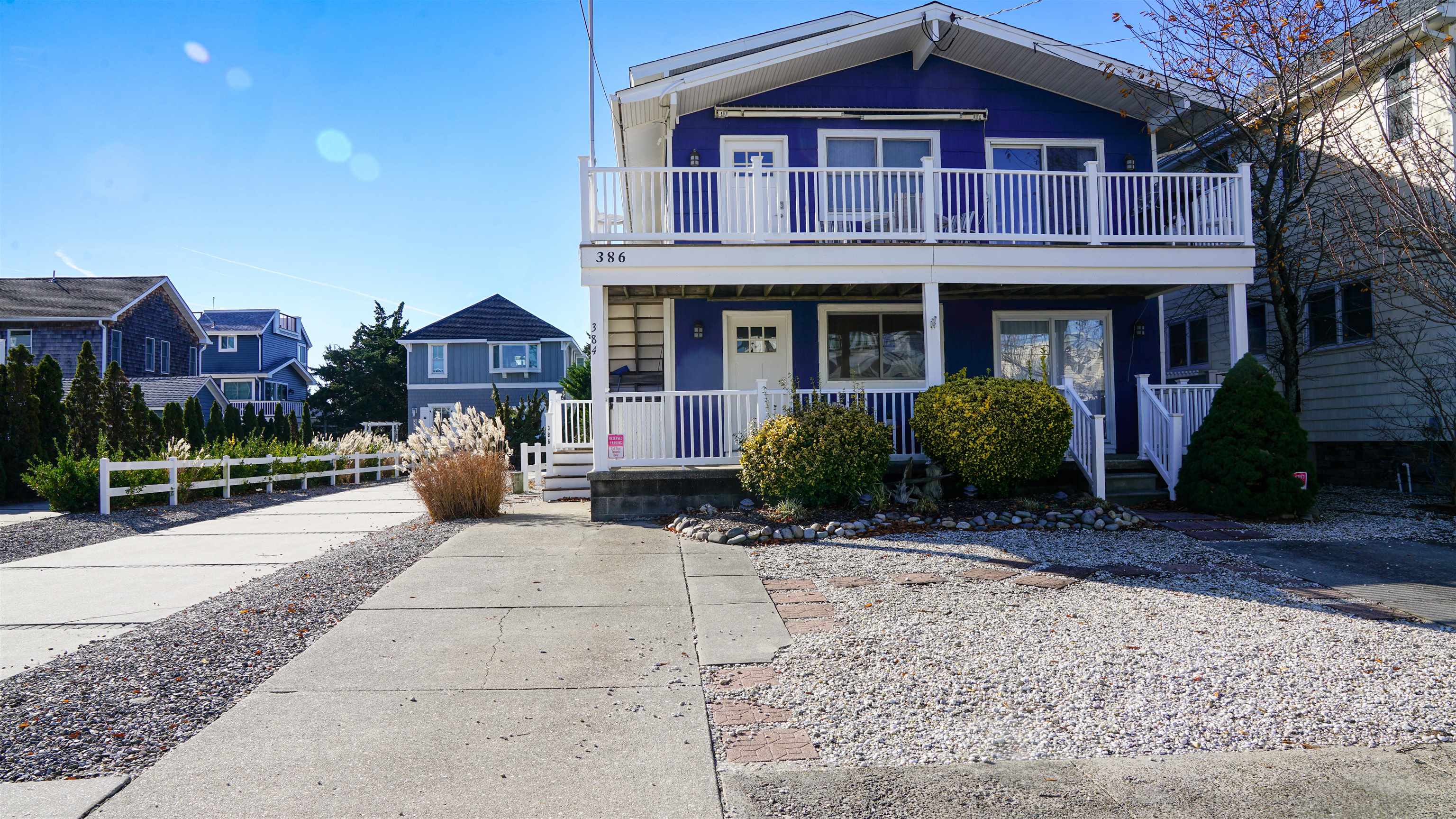 386 24th Street, Unit UPPR Avalon, NJ 08202 - Photo 30 of 34 a view of a house with a yard and plants