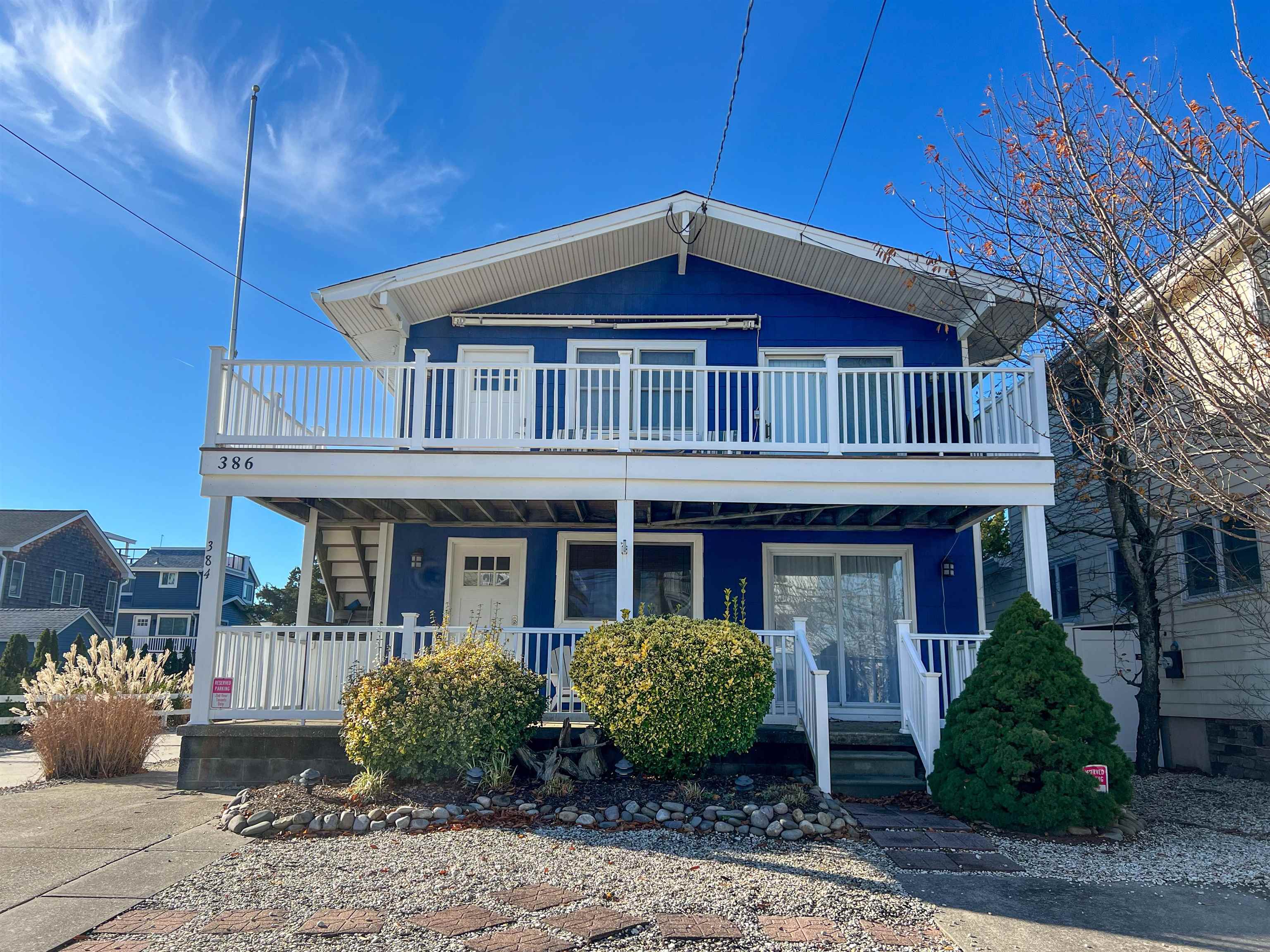 386 24th Street, Unit UPPR Avalon, NJ 08202 - Photo 31 of 34 a front view of a house with garden
