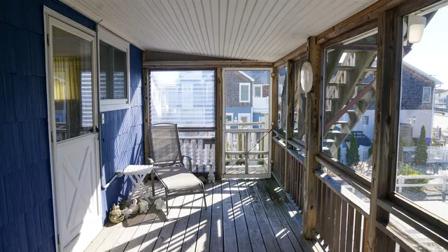 a view of balcony with furniture