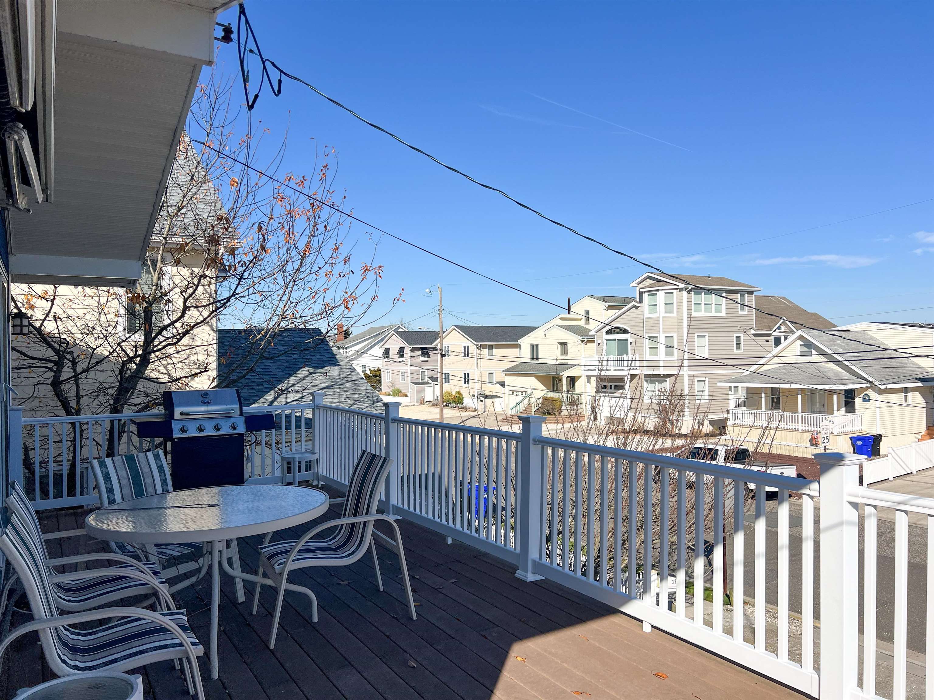 386 24th Street, Unit UPPR Avalon, NJ 08202 - Photo 34 of 34 a view of a balcony dining table and chairs