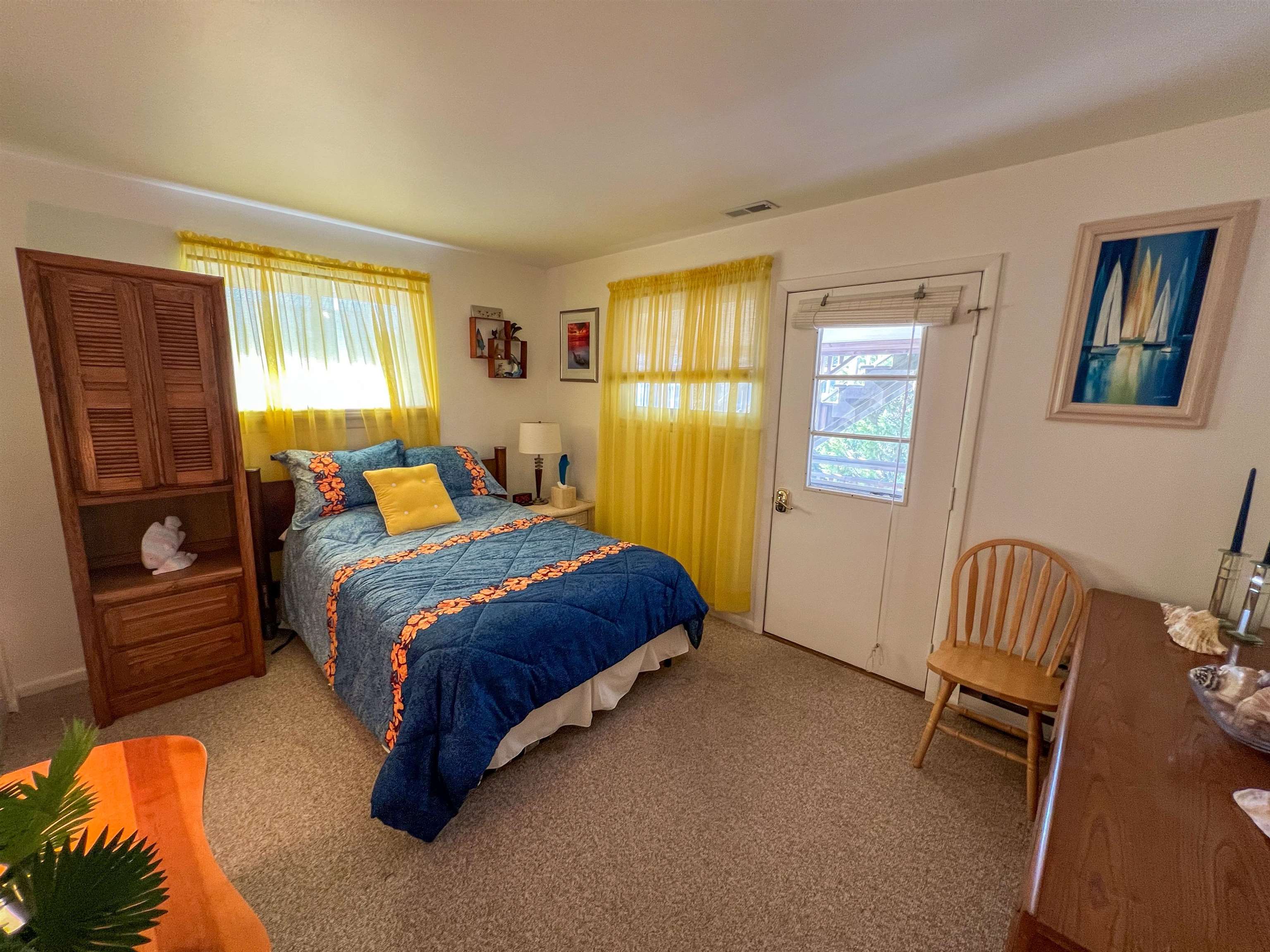 386 24th Street, Unit UPPR Avalon, NJ 08202 - Photo 9 of 34 a bedroom with a bed and a window