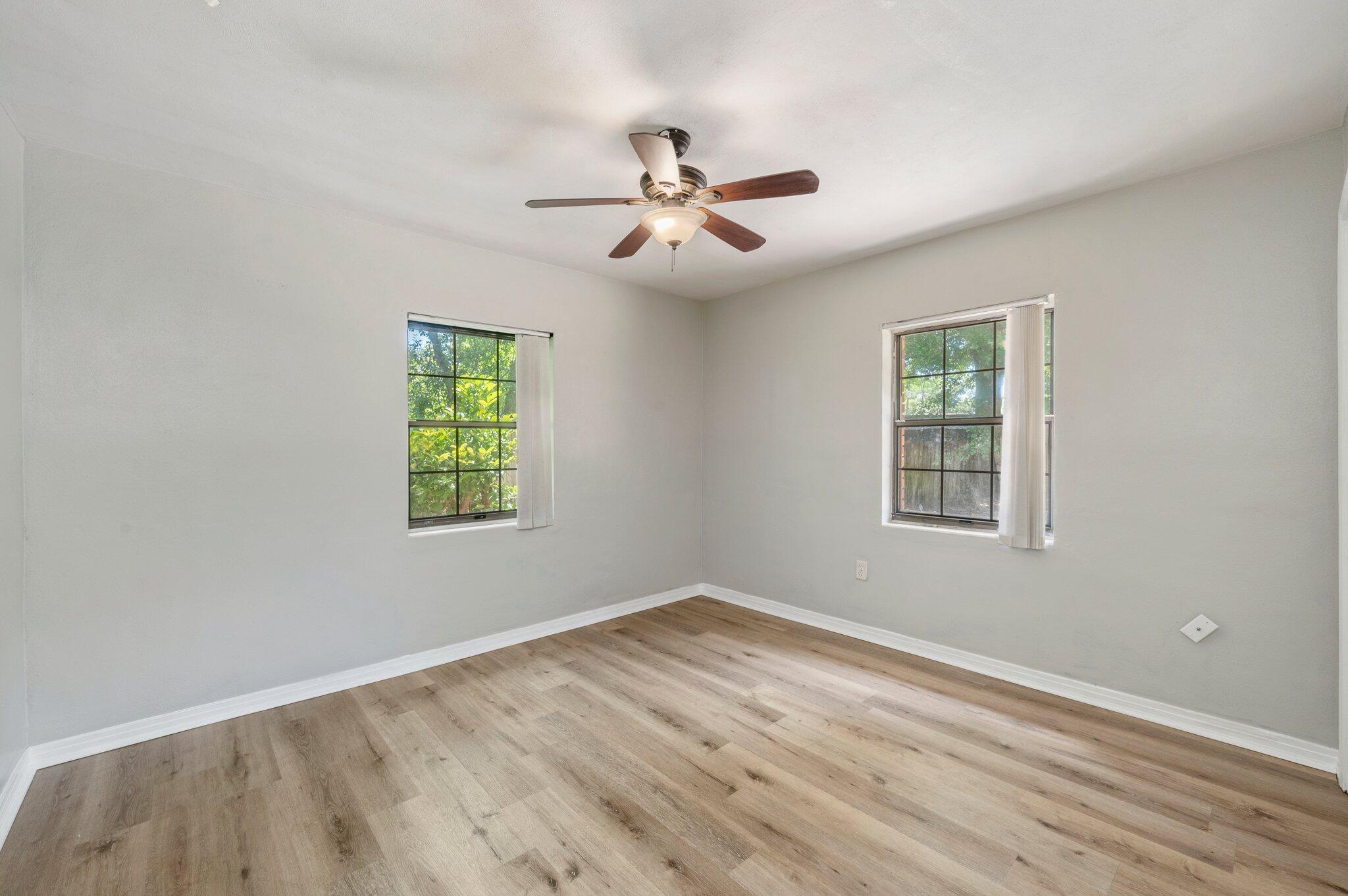 101 Seminole Trail Crestview, FL 32536 - Photo 16 of 30 an empty room with windows and fan