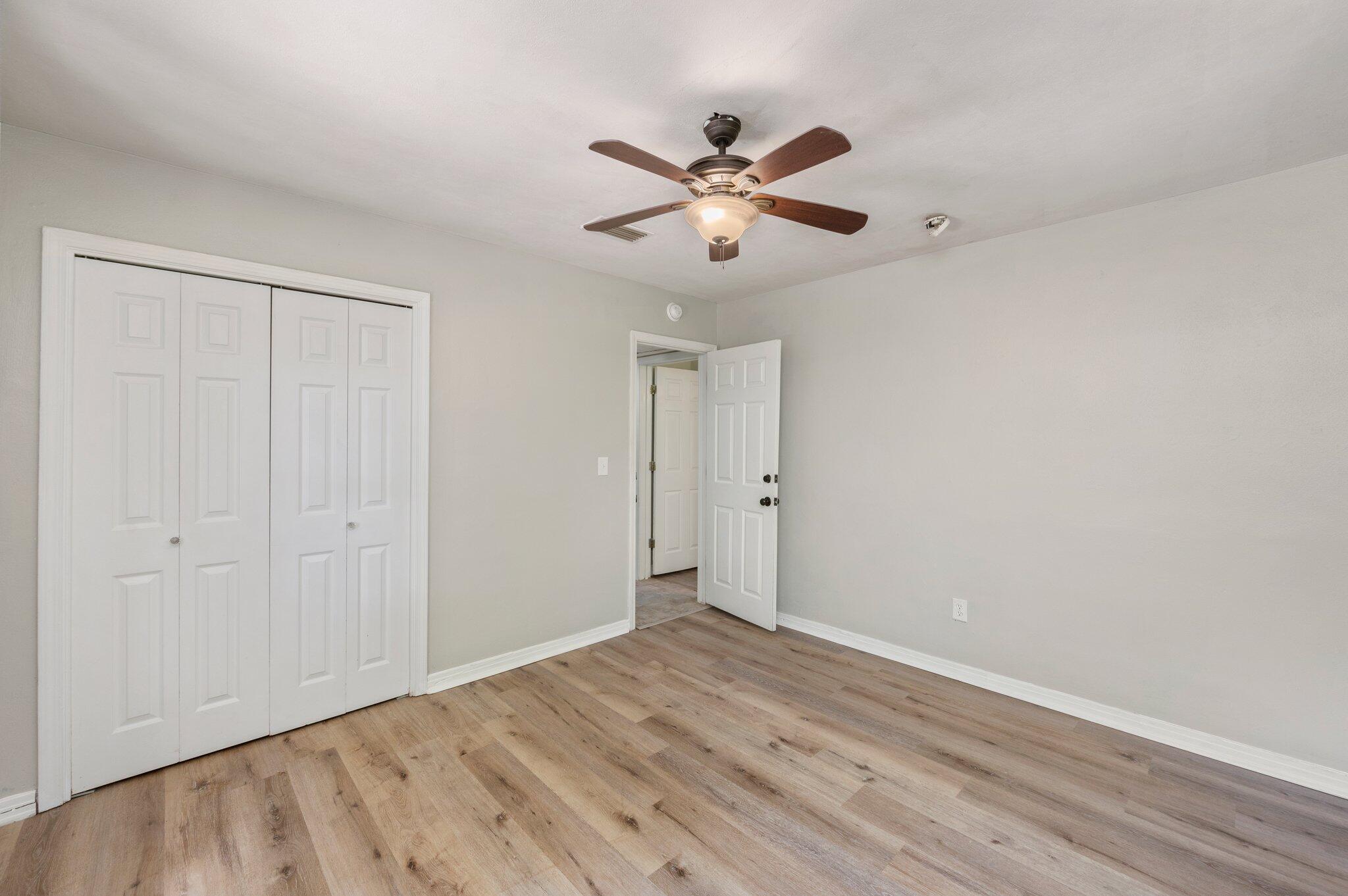 101 Seminole Trail Crestview, FL 32536 - Photo 17 of 30 a view of an empty room with wooden floor