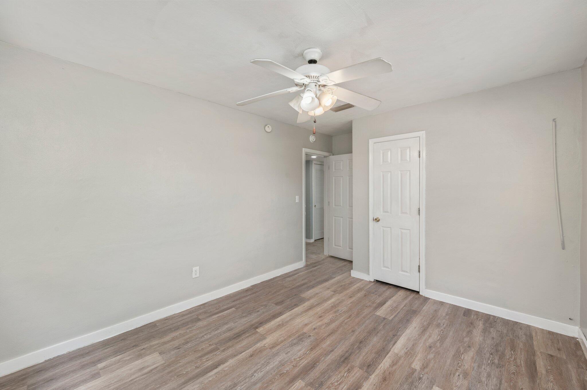 101 Seminole Trail Crestview, FL 32536 - Photo 19 of 30 a view of an empty room and wooden floor