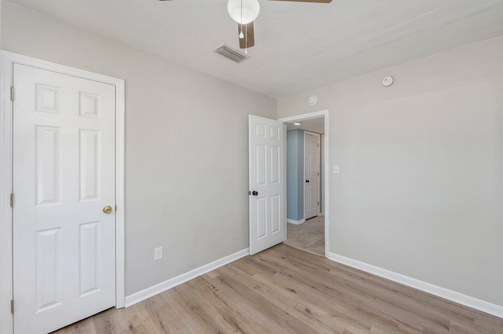 101 Seminole Trail Crestview, FL 32536 - Photo 21 of 30 a view of an empty room with wooden floor