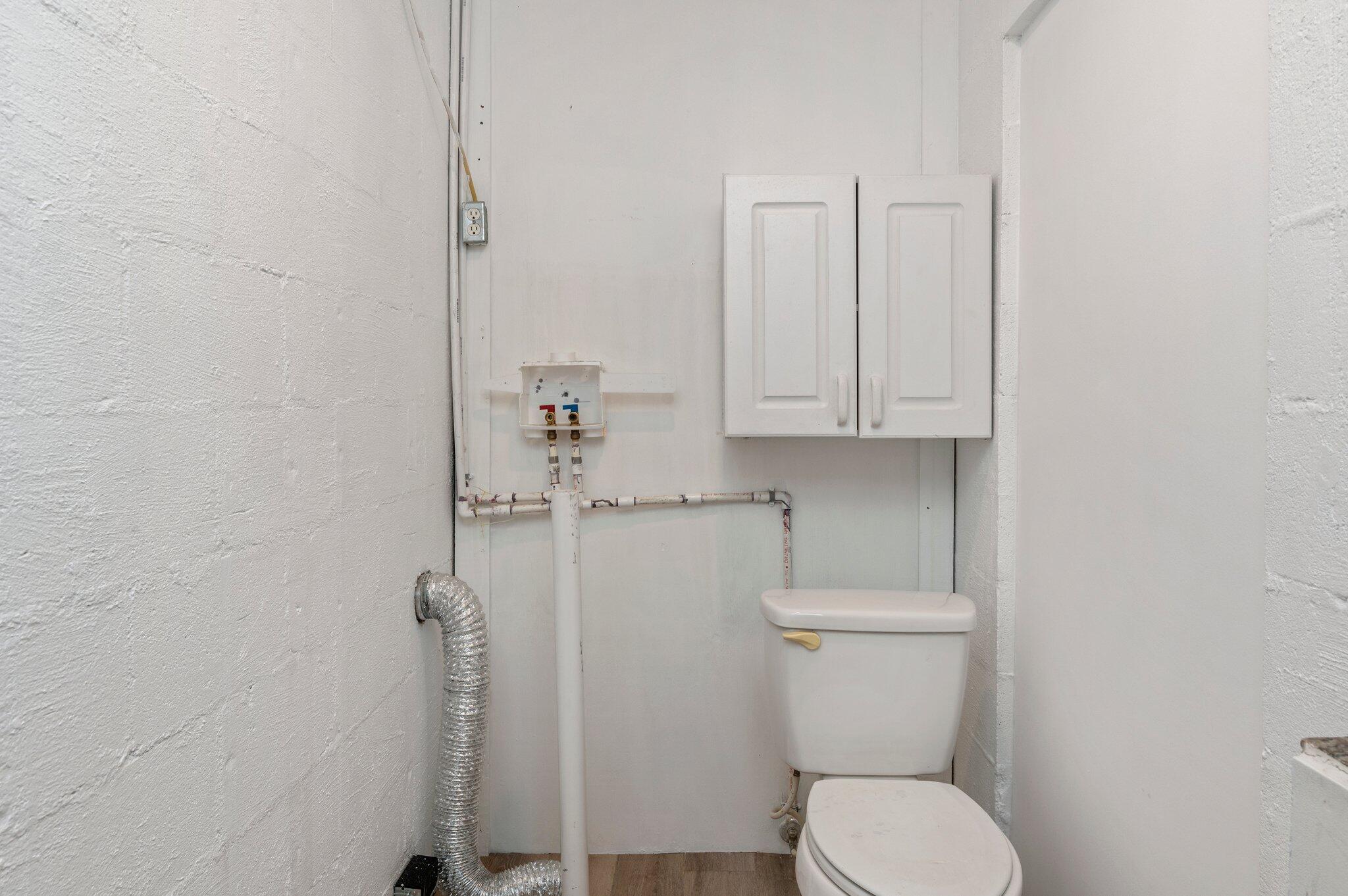 101 Seminole Trail Crestview, FL 32536 - Photo 24 of 30 a white toilet sitting next to a sink