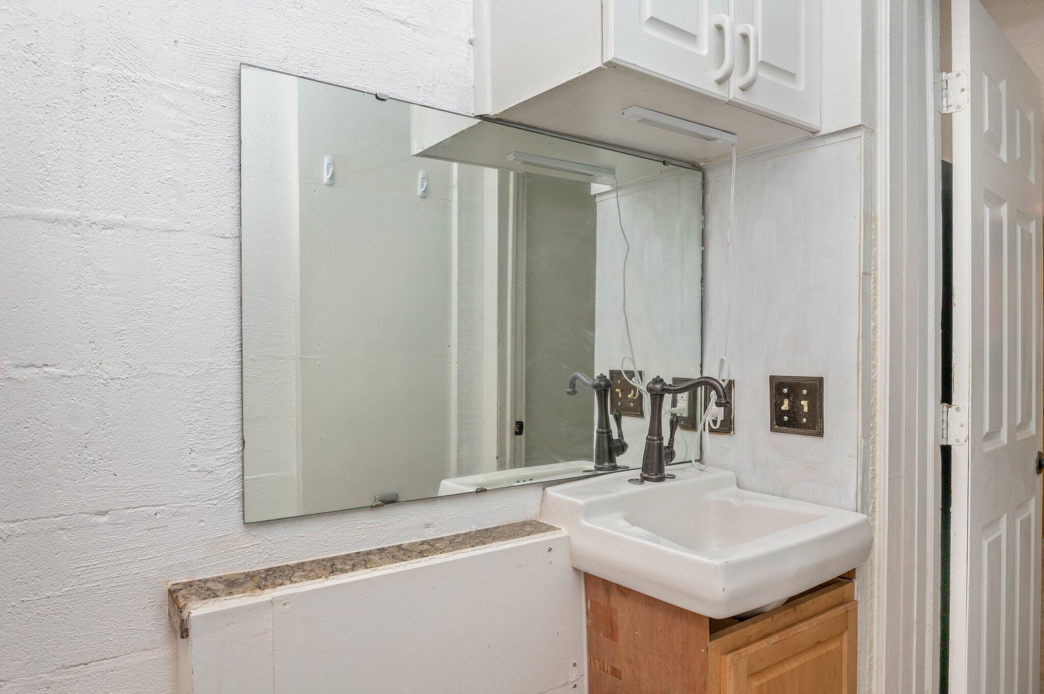 101 Seminole Trail Crestview, FL 32536 - Photo 25 of 30 a bathroom with a sink a mirror and a bathtub