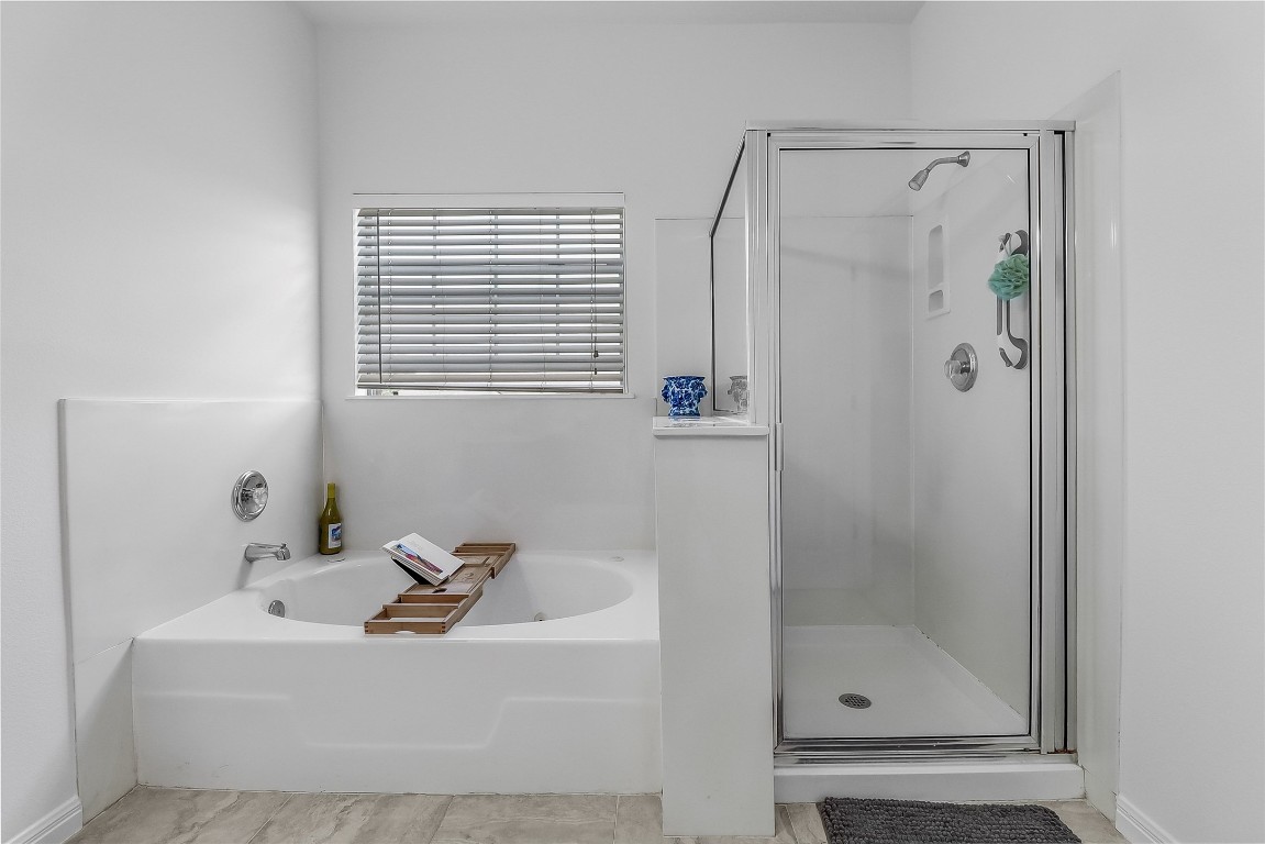5515 Davis Lane, Unit 52 Austin, TX 78749 - Photo 13 of 30 a bathroom with a bathtub and a shower