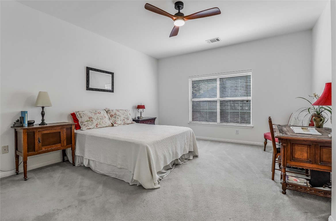 5515 Davis Lane, Unit 52 Austin, TX 78749 - Photo 26 of 30 a spacious bedroom with a bed and a window