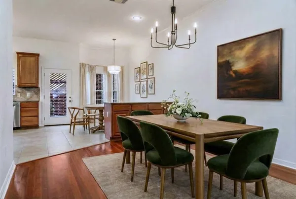 a kitchen with stainless steel appliances granite countertop a stove a sink a microwave and a refrigerator