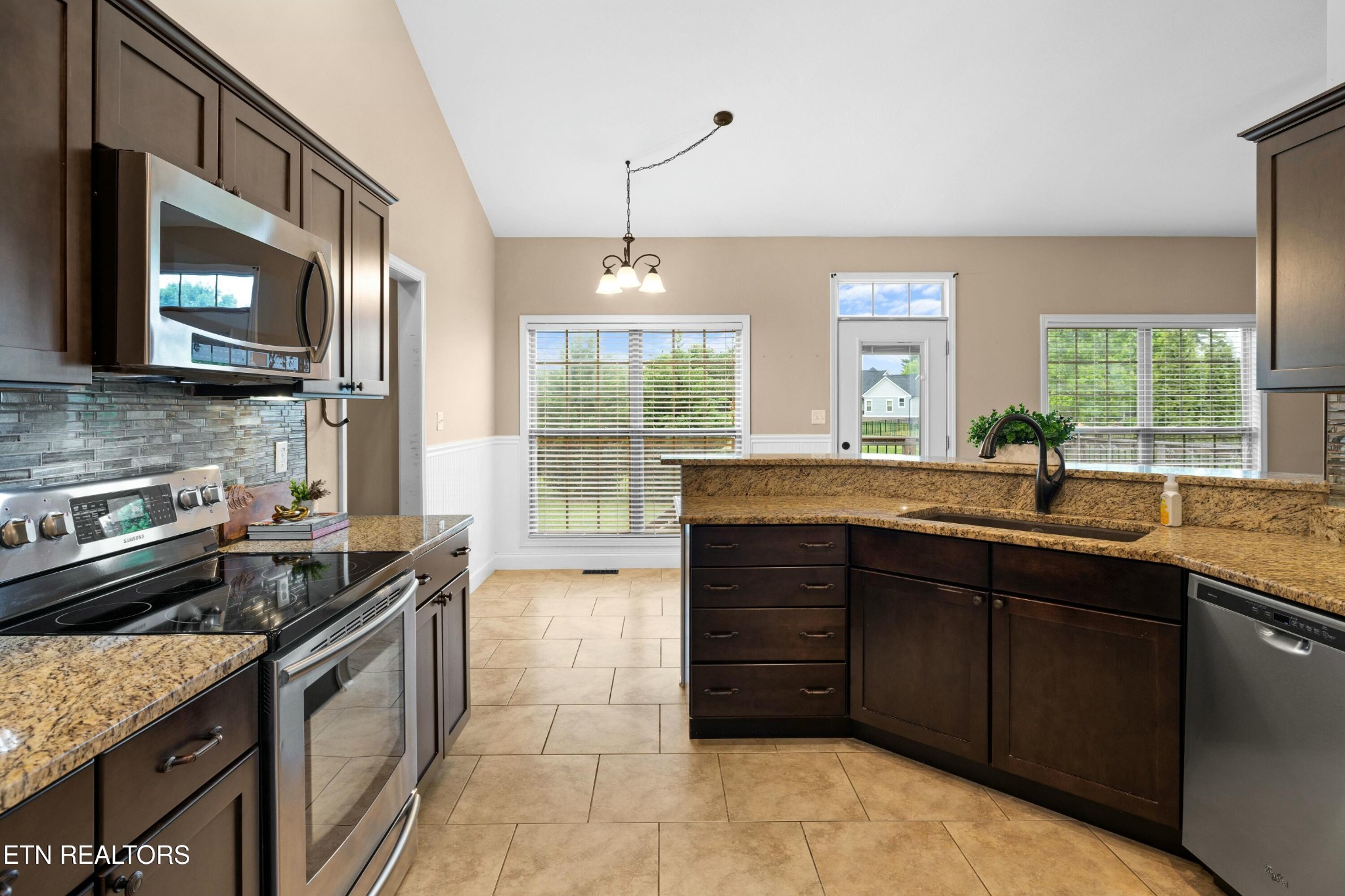 402 Lee Lambert Road Maryville, TN 37803 - Photo 12 of 41 a kitchen with a sink and a stove
