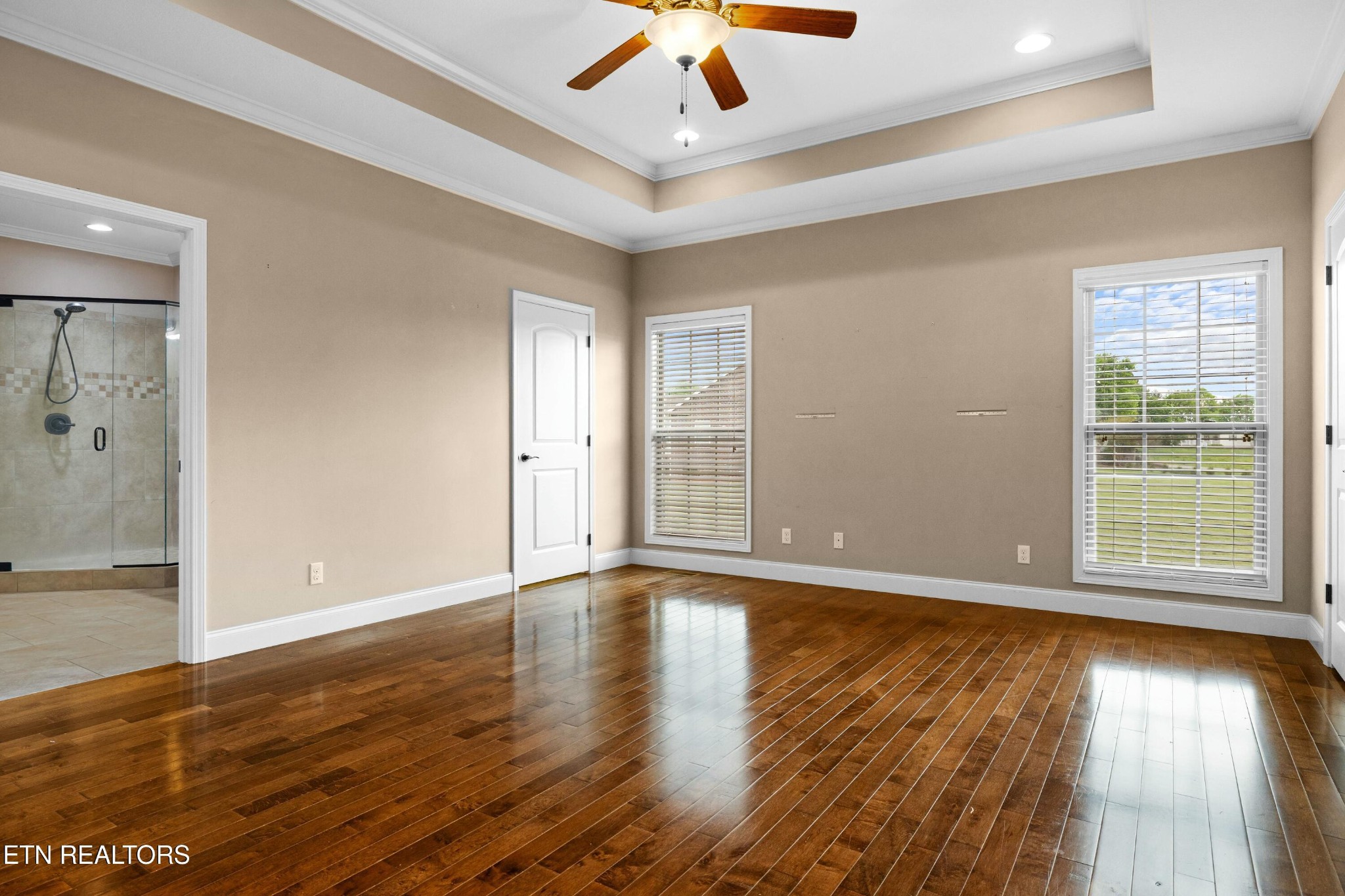 402 Lee Lambert Road Maryville, TN 37803 - Photo 18 of 41 a view of an empty room with wooden floor and a window