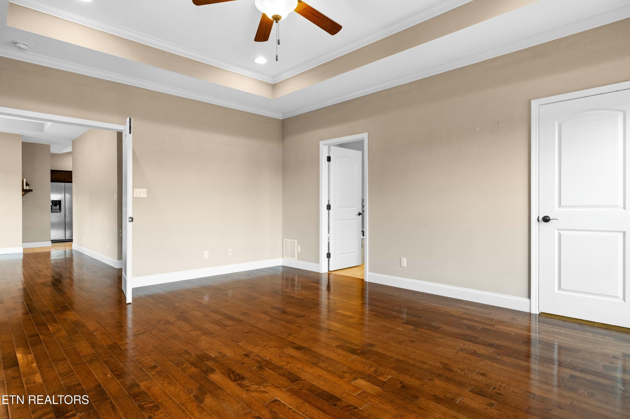 402 Lee Lambert Road Maryville, TN 37803 - Photo 19 of 41 an empty room with wooden floor and ceiling fan