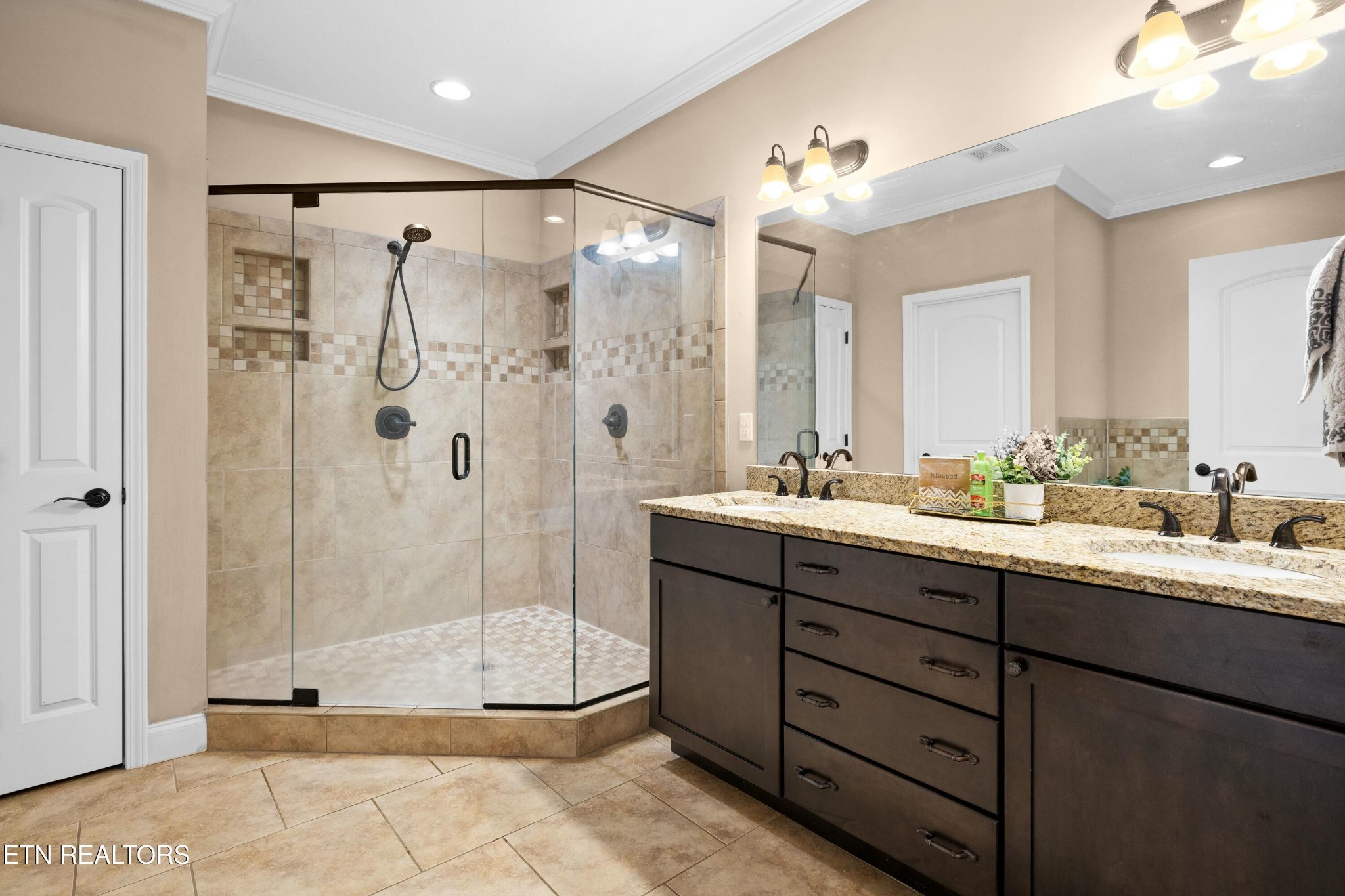 402 Lee Lambert Road Maryville, TN 37803 - Photo 21 of 41 a bathroom with a double vanity sink mirror and shower