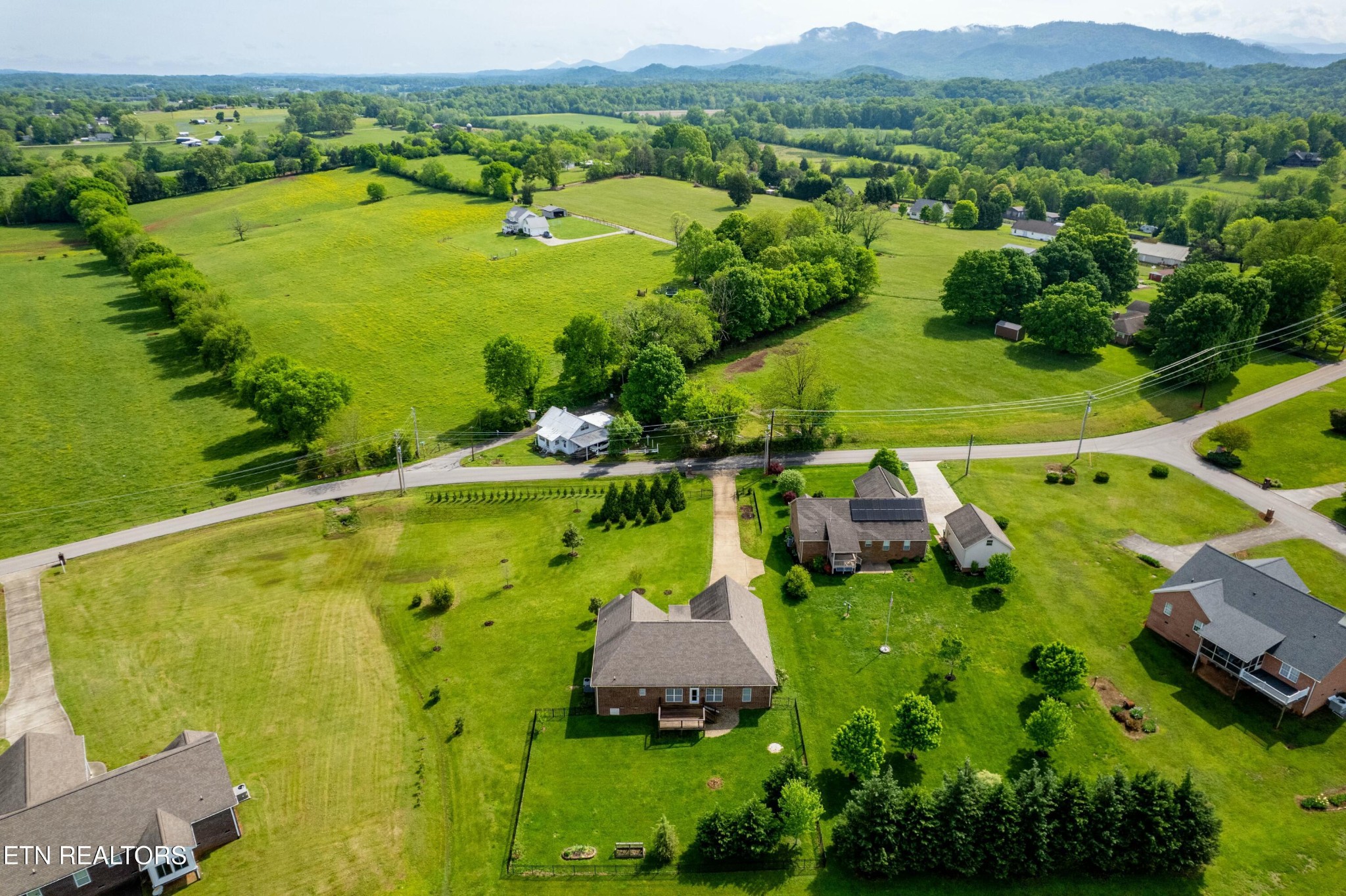 402 Lee Lambert Road Maryville, TN 37803 - Photo 36 of 41 an aerial view of a residential houses with outdoor space and a lake view