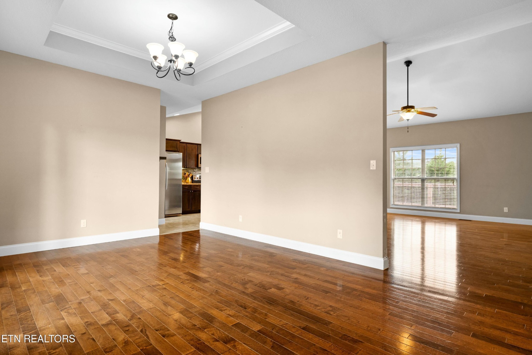 402 Lee Lambert Road Maryville, TN 37803 - Photo 4 of 41 a view of an empty room with wooden floor and a window