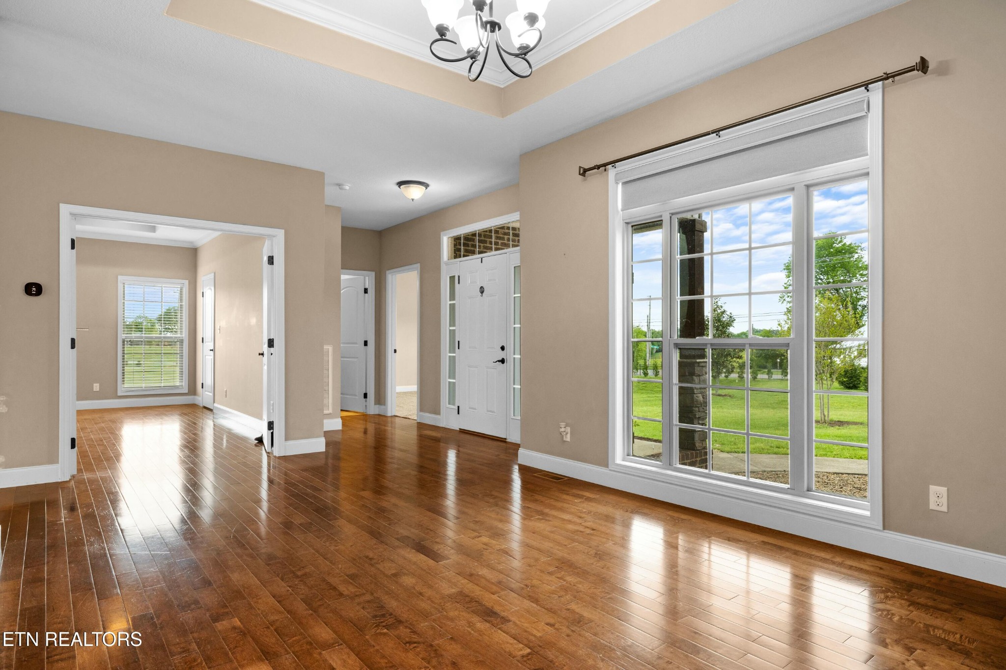 402 Lee Lambert Road Maryville, TN 37803 - Photo 5 of 41 a view of an empty room with wooden floor and a window