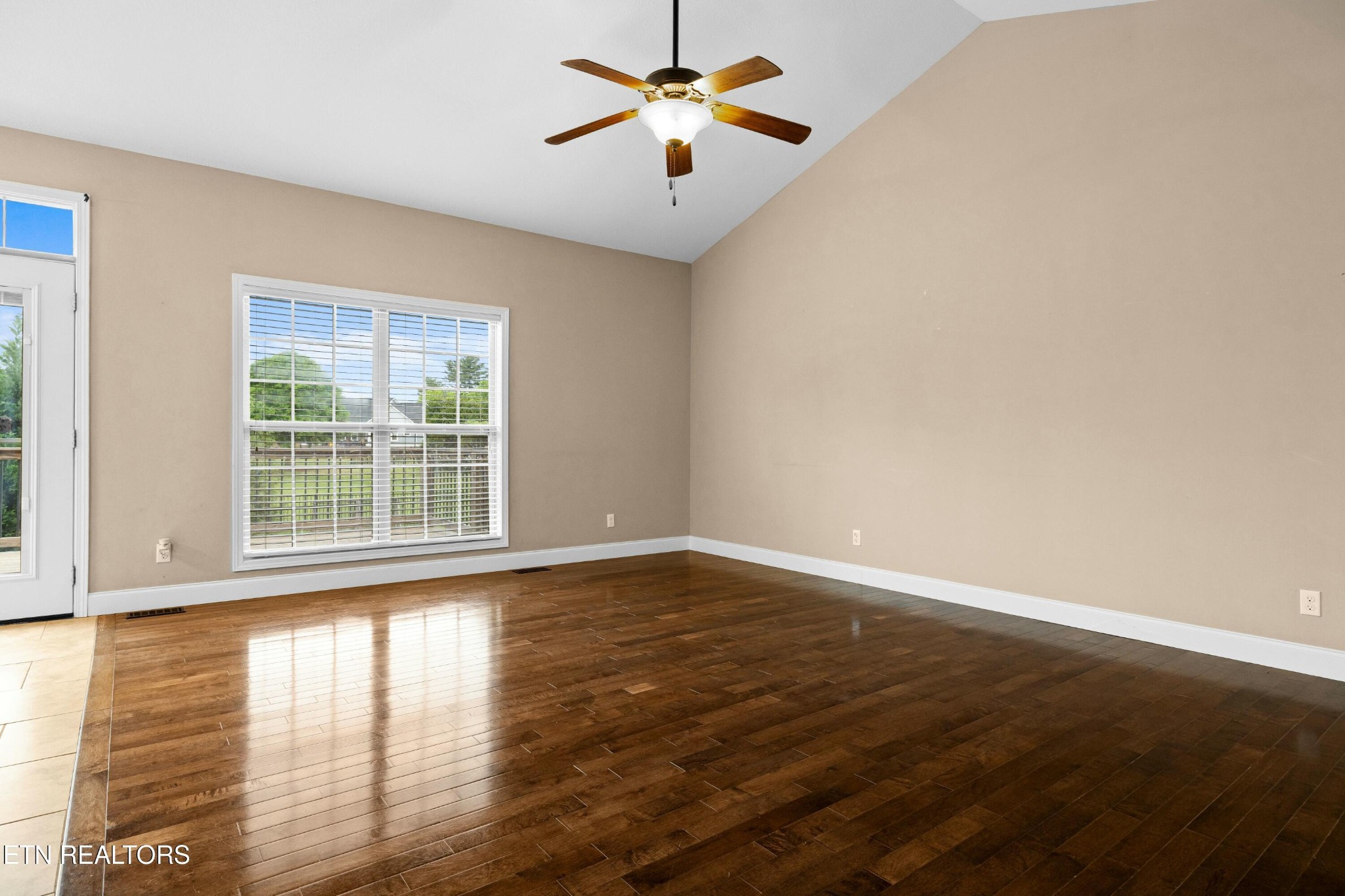 402 Lee Lambert Road Maryville, TN 37803 - Photo 6 of 41 a view of empty room with wooden floor and fan