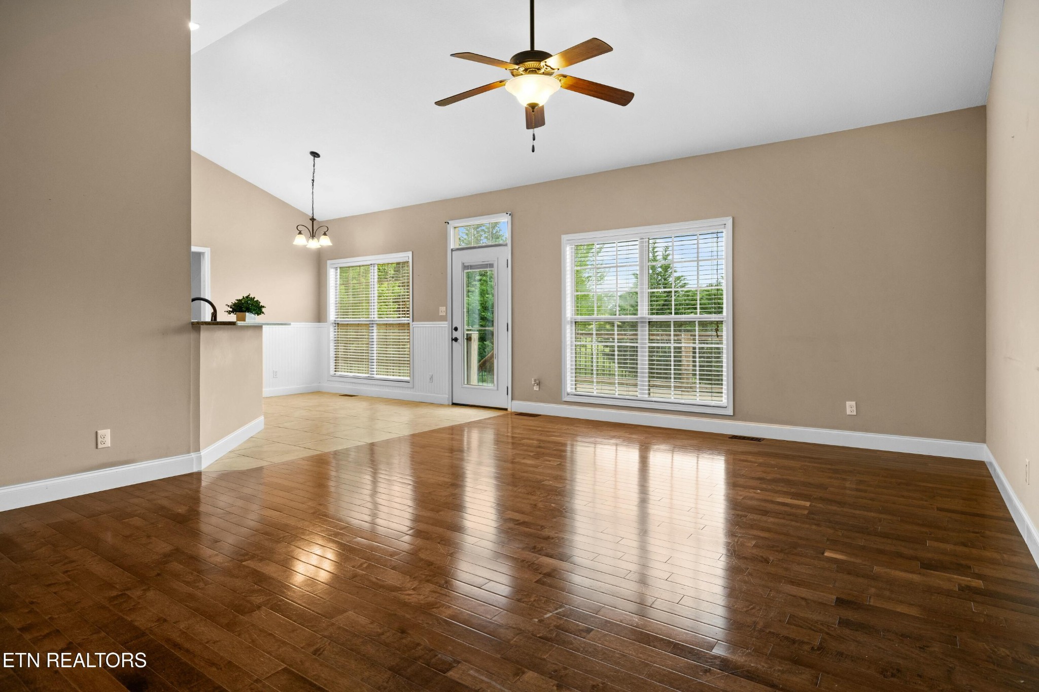 402 Lee Lambert Road Maryville, TN 37803 - Photo 8 of 41 a view of an empty room with window and wooden floor