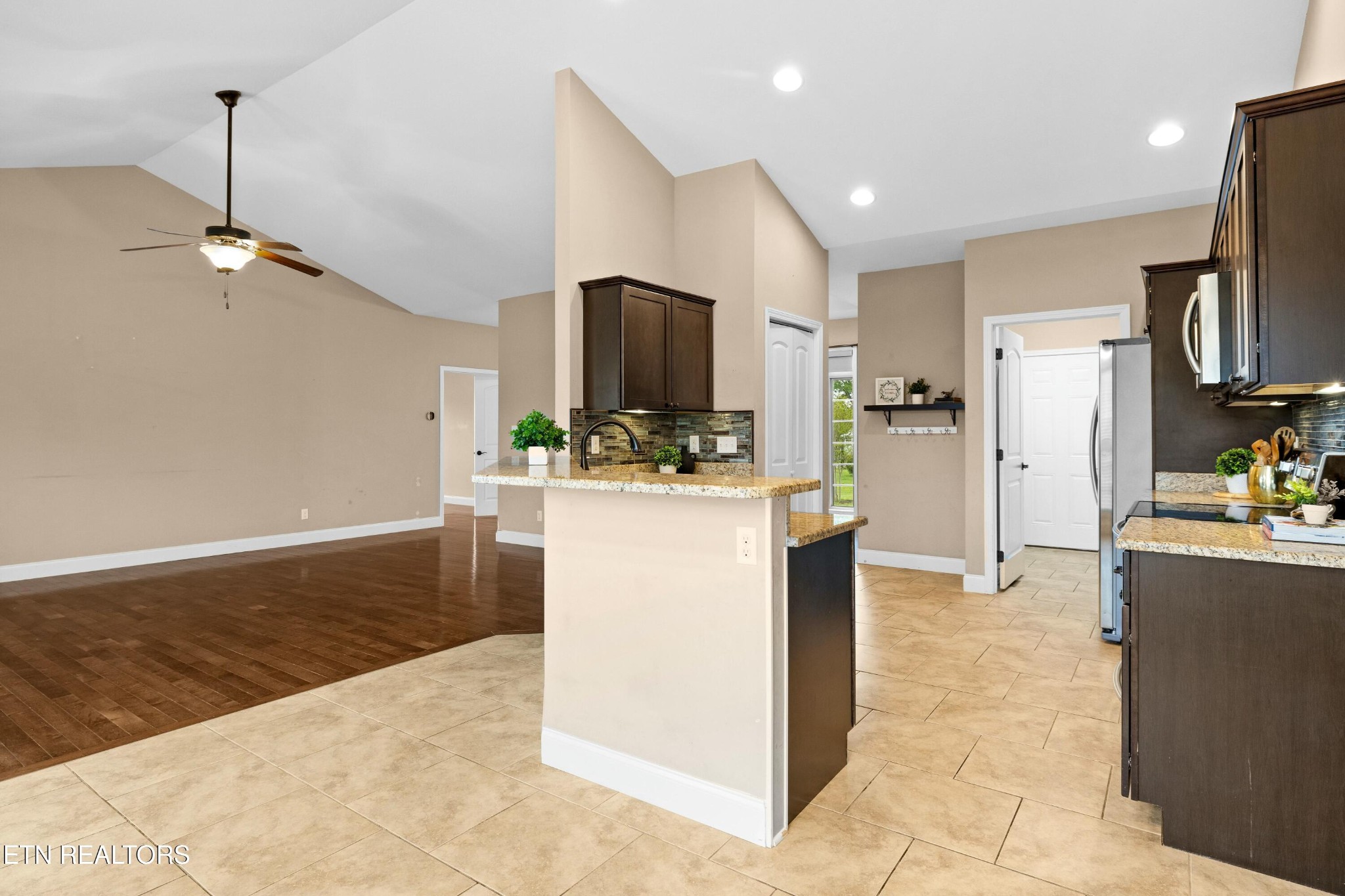 402 Lee Lambert Road Maryville, TN 37803 - Photo 9 of 41 a kitchen with kitchen island a counter top space a sink stainless steel appliances and cabinets