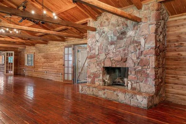 a view of a hall with wooden floor