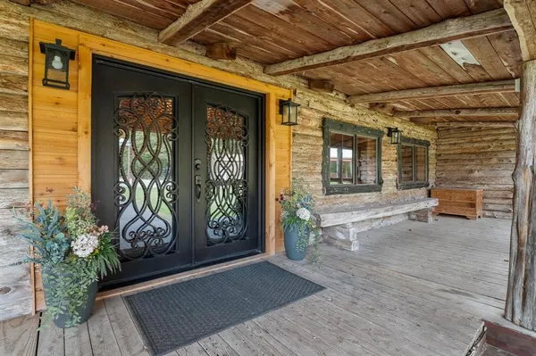 a view of porch with furniture and a potted plant