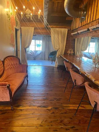 a view of a hall with wooden floor