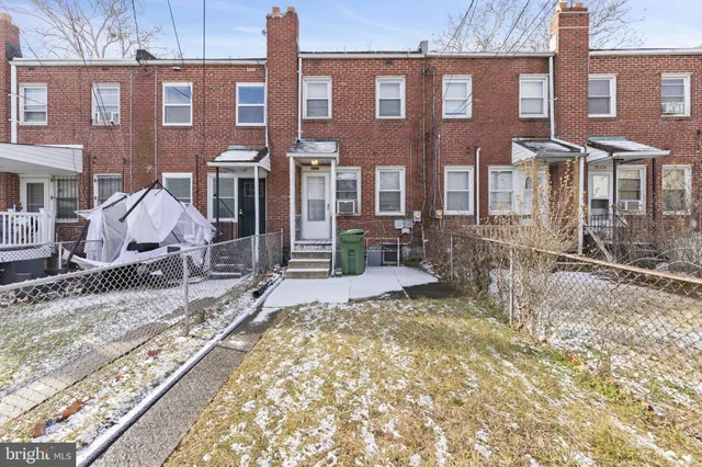 a view of a brick building with many windows