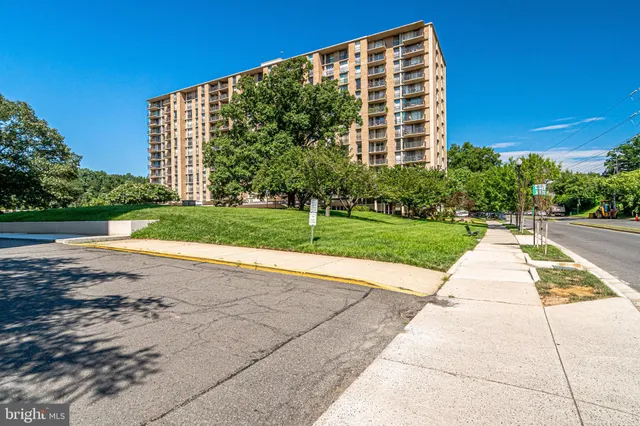 a view of a building with a yard
