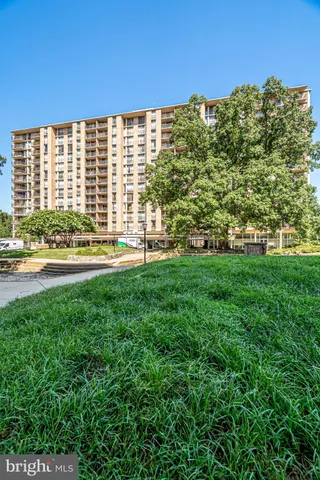 a view of a large building with a yard