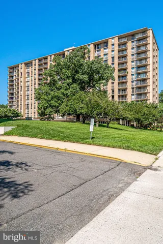 a view of a big building with a yard